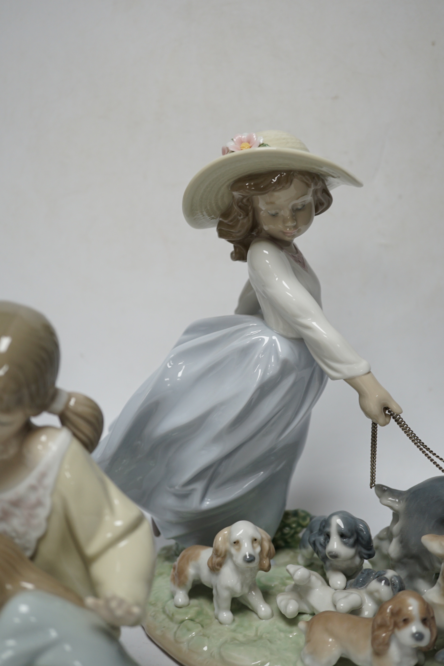 A large Lladro figure group “La gran familia, Puppy Brigade”, Baby Jesus, Duckling, New Friend, Chit-Chat, Sunday’s Child, Little Sister, Cat and Mouse and heavenly Tenor (9), largest 30 cm wide
